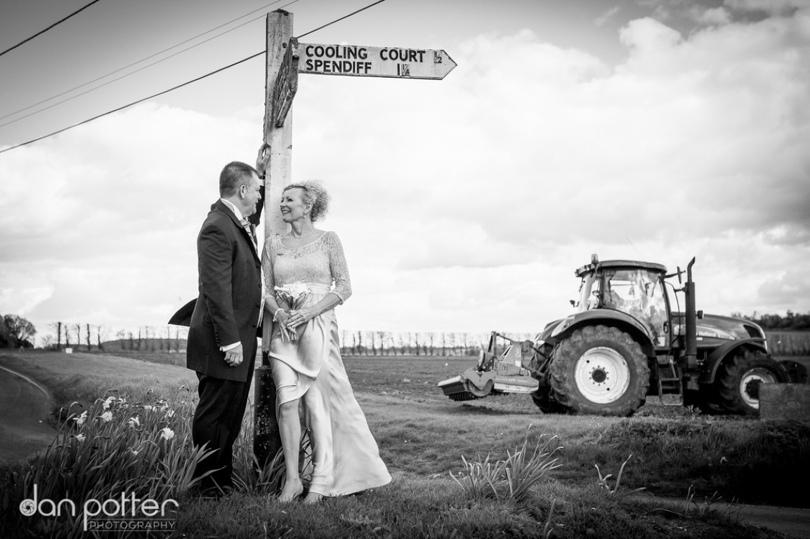 countryside wedding showing farmers tractor