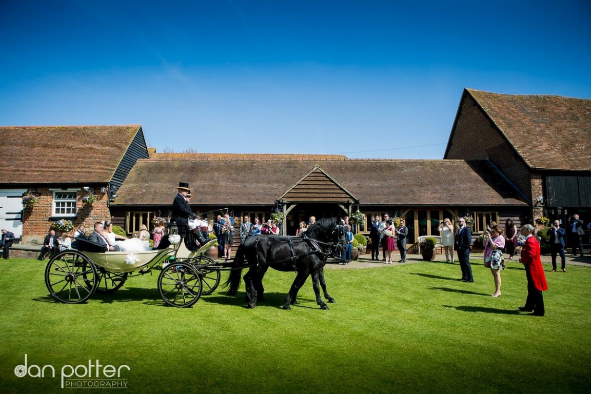 horse and cart outside heritage barn