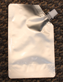 Flat foil bag with spout