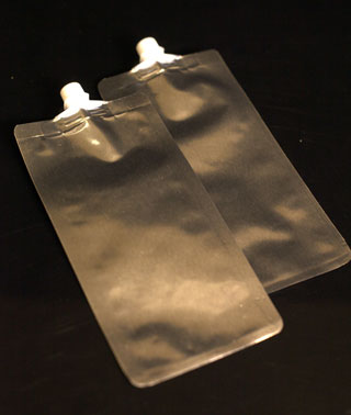 Flat foil squeeze spout bags