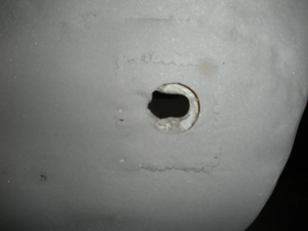 82 RR bumper mt hole.JPG