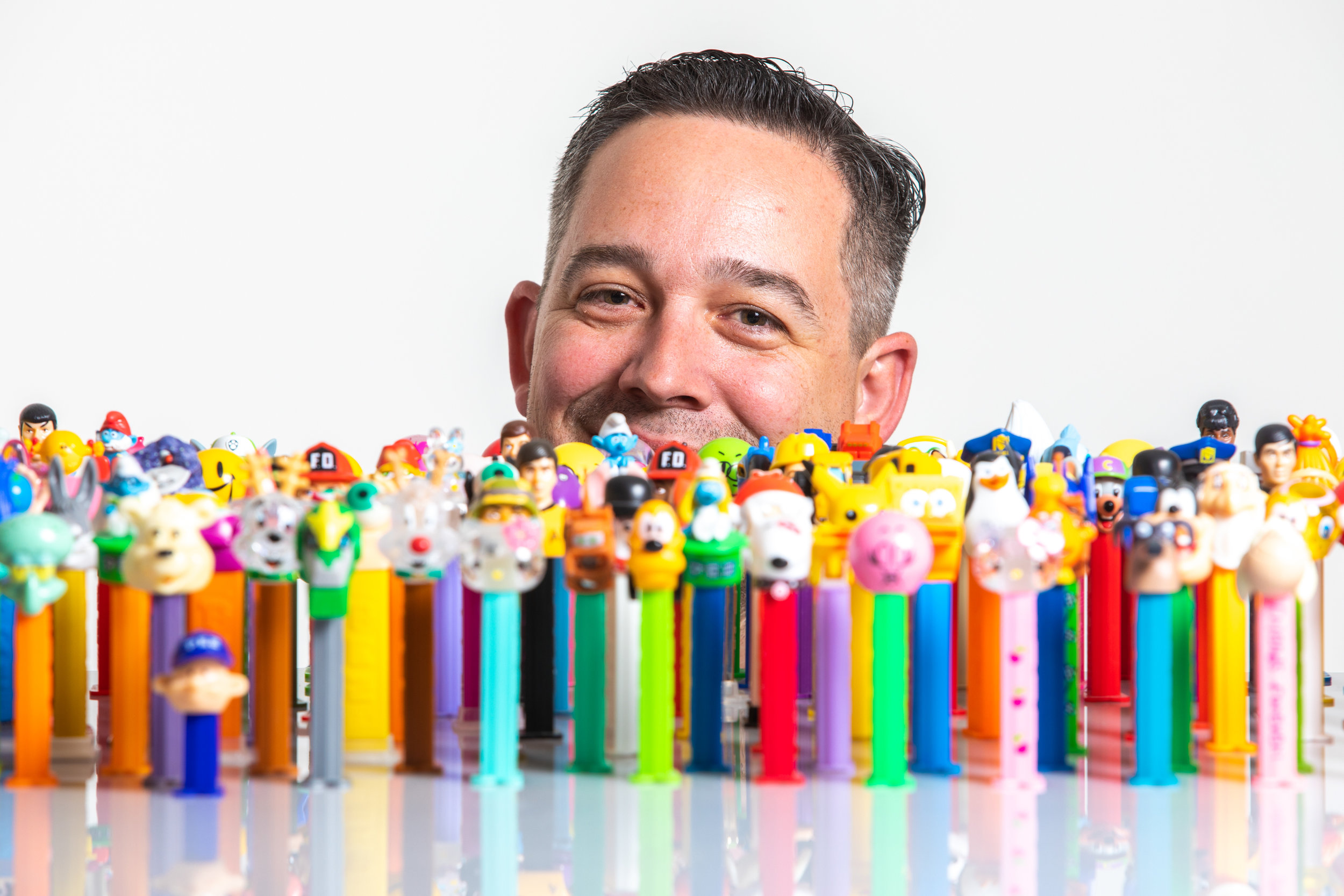 Justin Hansen, Pez dispenser collector, sits for a portrait with his collection on Thursday, Jan. 31, 2019. Hansen hosts The Pez Collection Podcast. 