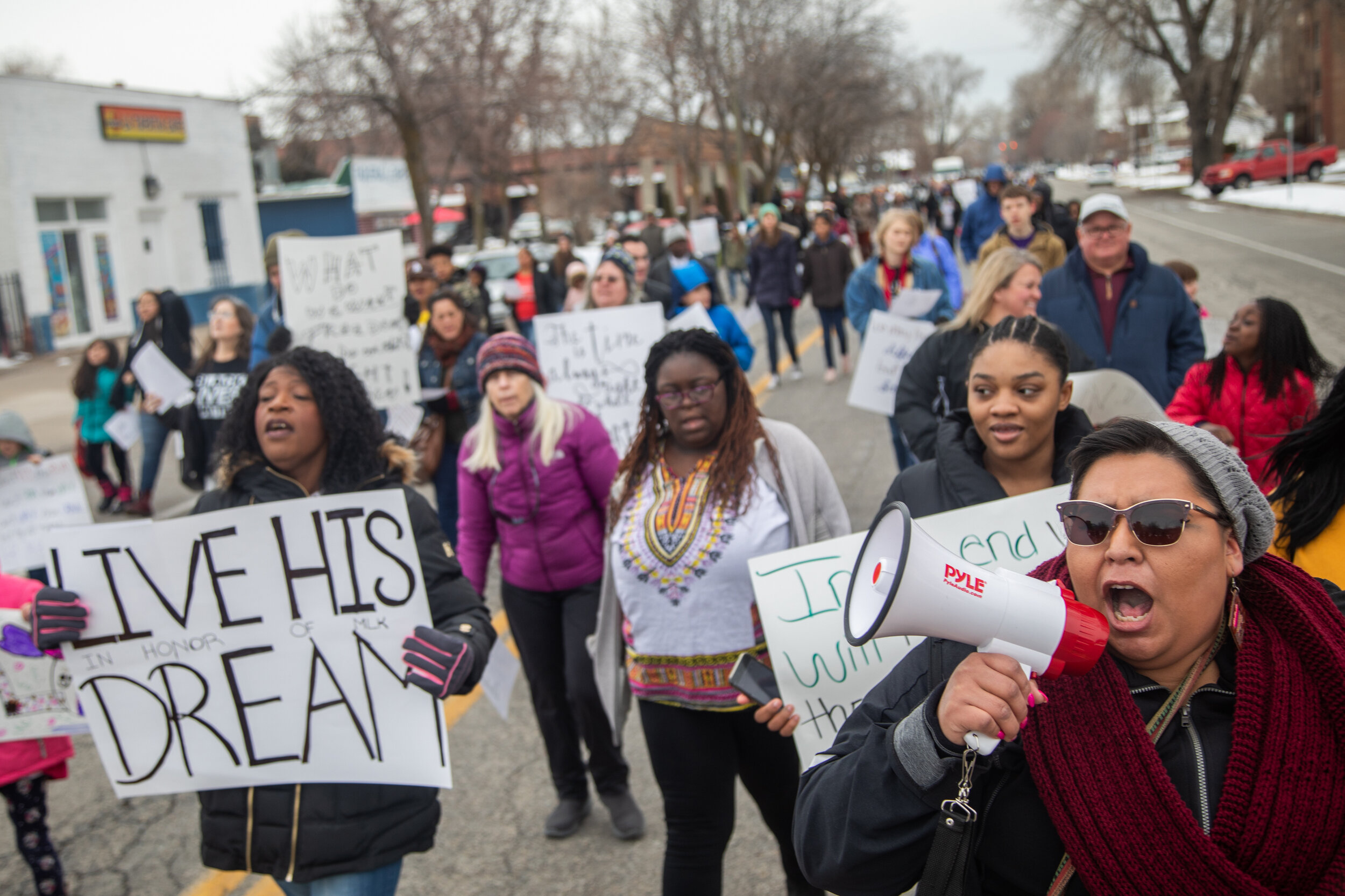  Community members march from the Marshall White Center to the Ogden Amphitheater to honor Martin Luther King Jr. Day on Monday, Jan. 20, 2020. 