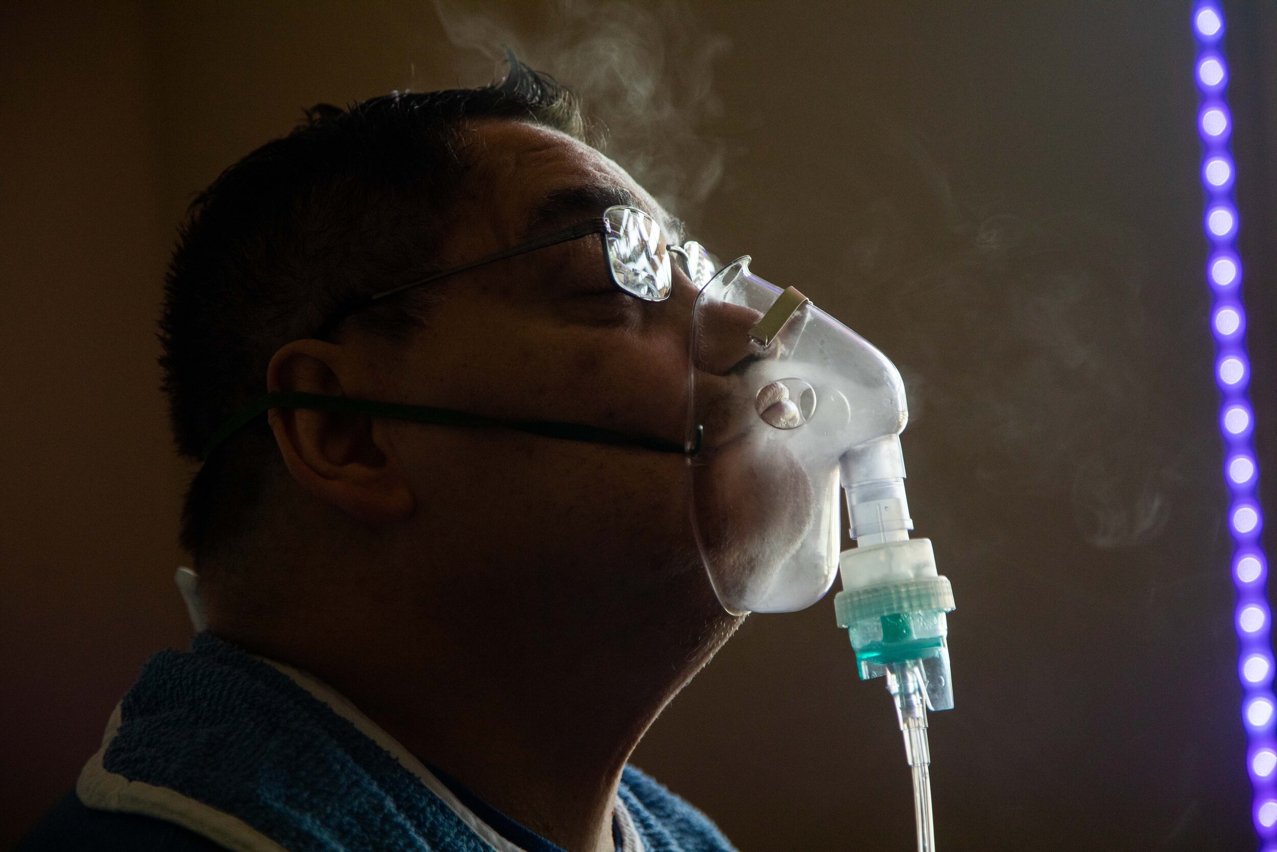  Ron Vigil wears his nebulizer on Friday, May 22, 2020, in Syracuse, Utah. Ron has cerebral palsy.  