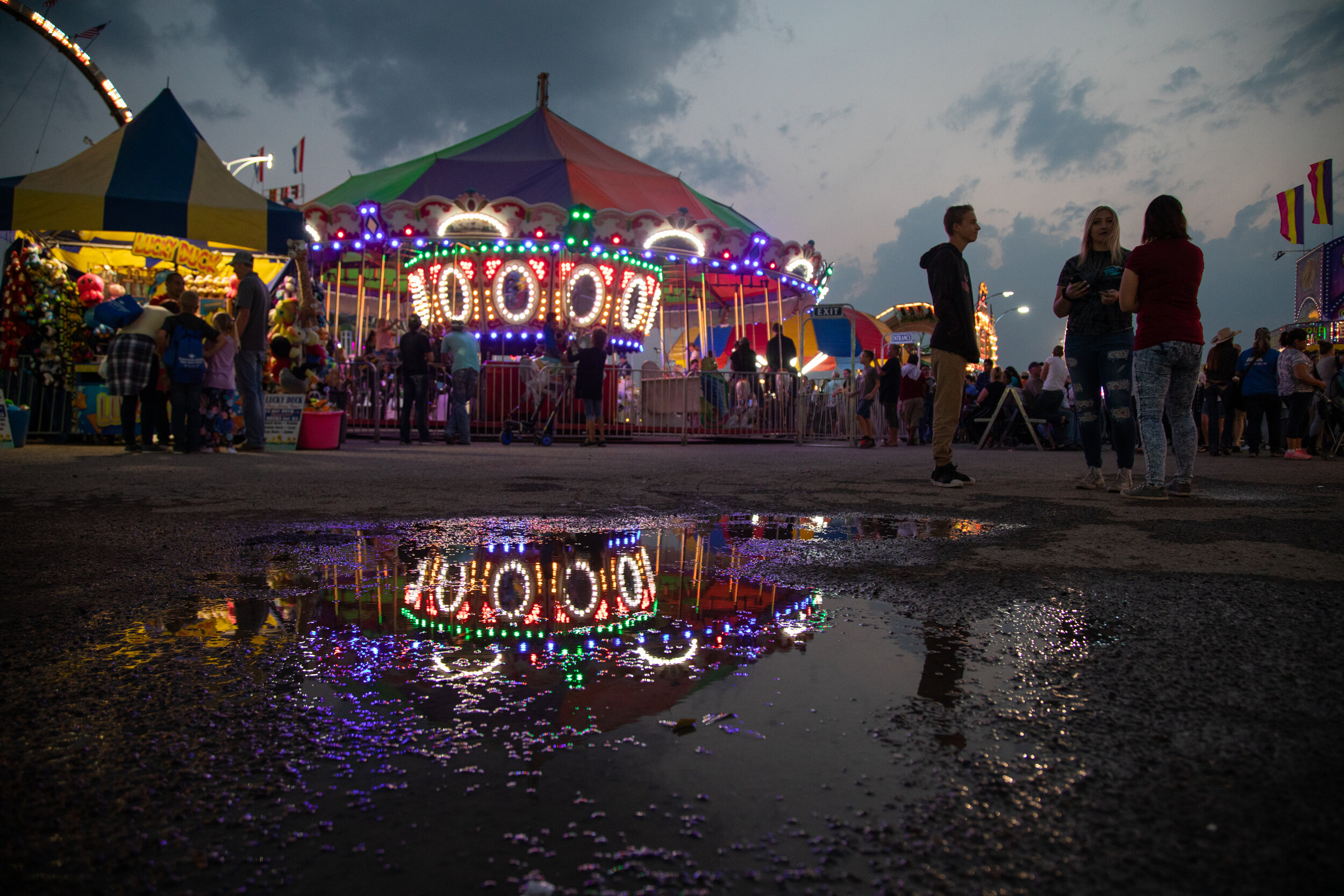  Old and young enjoy a stormy summer night at the Box Elder County Fair on Wednesday, Aug. 22, 2018. 