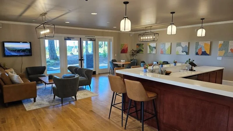 Lower-level seating area inside the Ocelli Cellars tasting room near Dundee, Oregon, where visitors enjoy winemaker-led Grenache flights in the heart of the Willamette Valley.