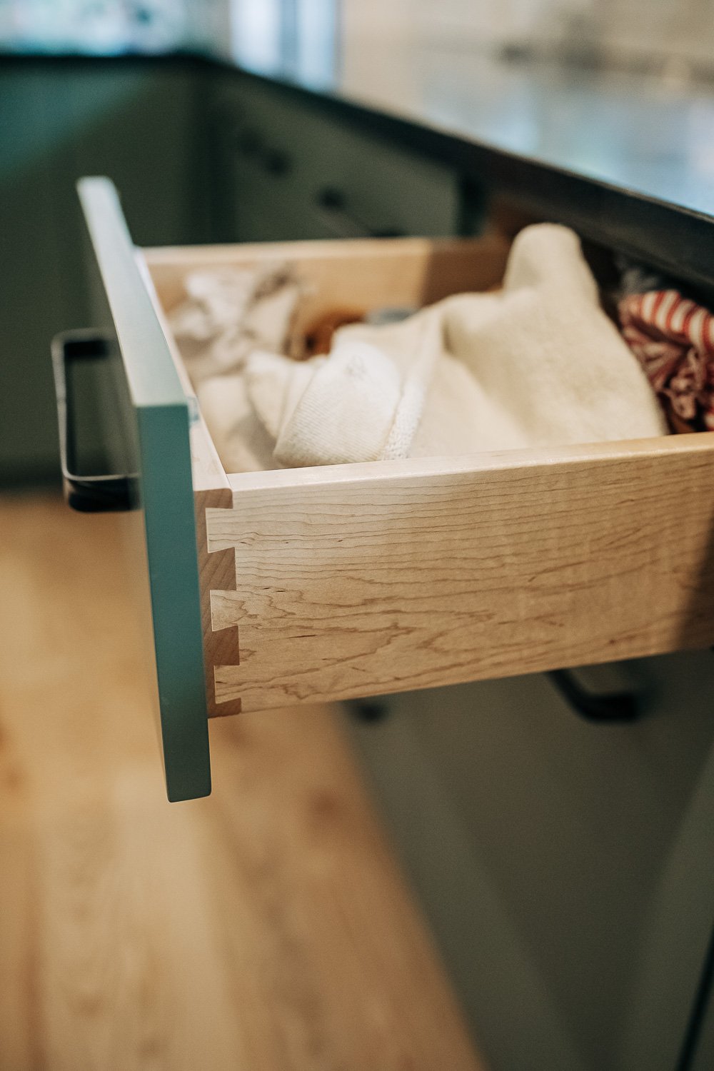 Custom dovetail drawer box detail in black walnut cabinetry showcasing precision millwork craftsmanship