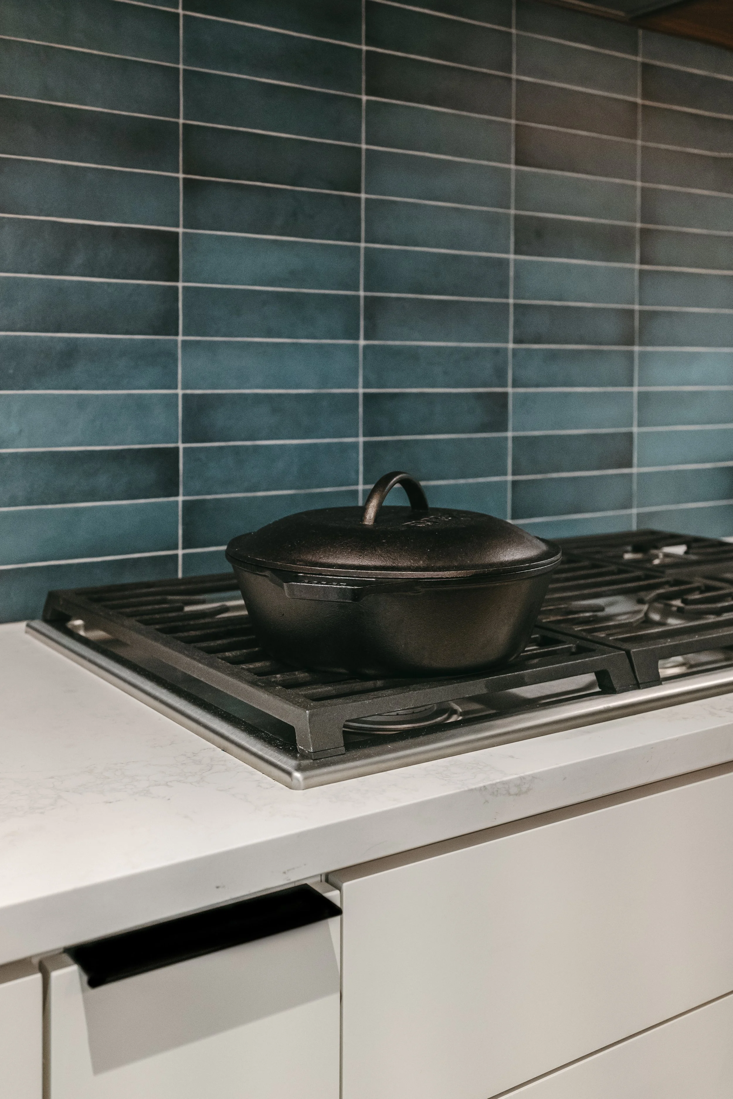 Custom woodwork by Sunnyside Millwork Open concept Two-tone kitchen with grain-matched walnut uppers, white lacquer cabinets, and integrated millwork island with quartz surface in Kernersville, North Carolina