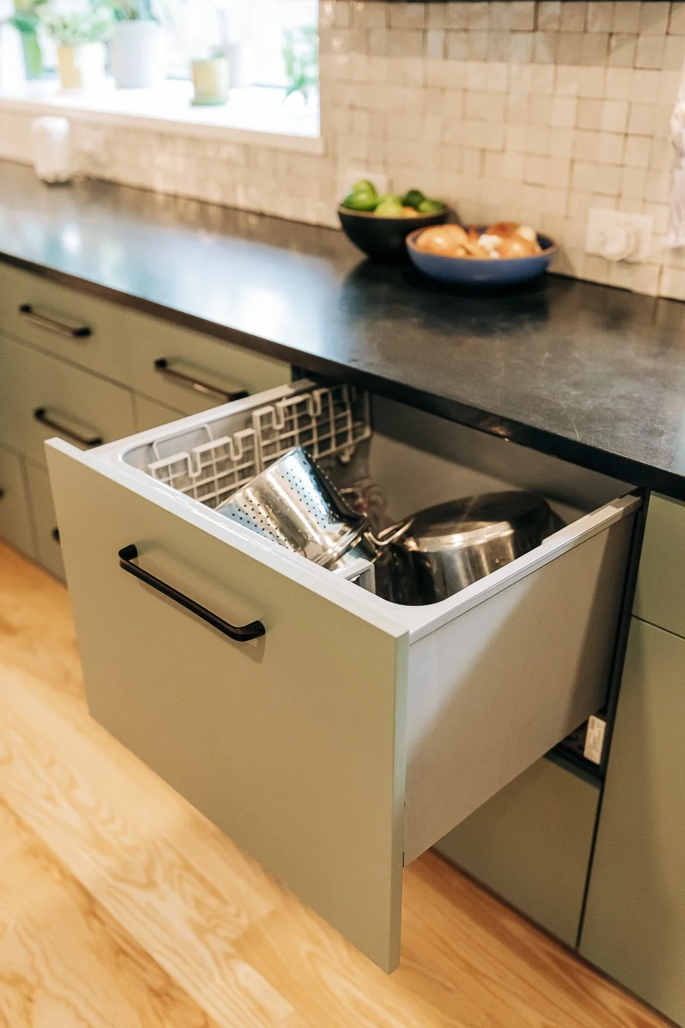 Drawer-style dishwasher integrated into painted cabinetry for space-efficient kitchen design in Bat Cave NC