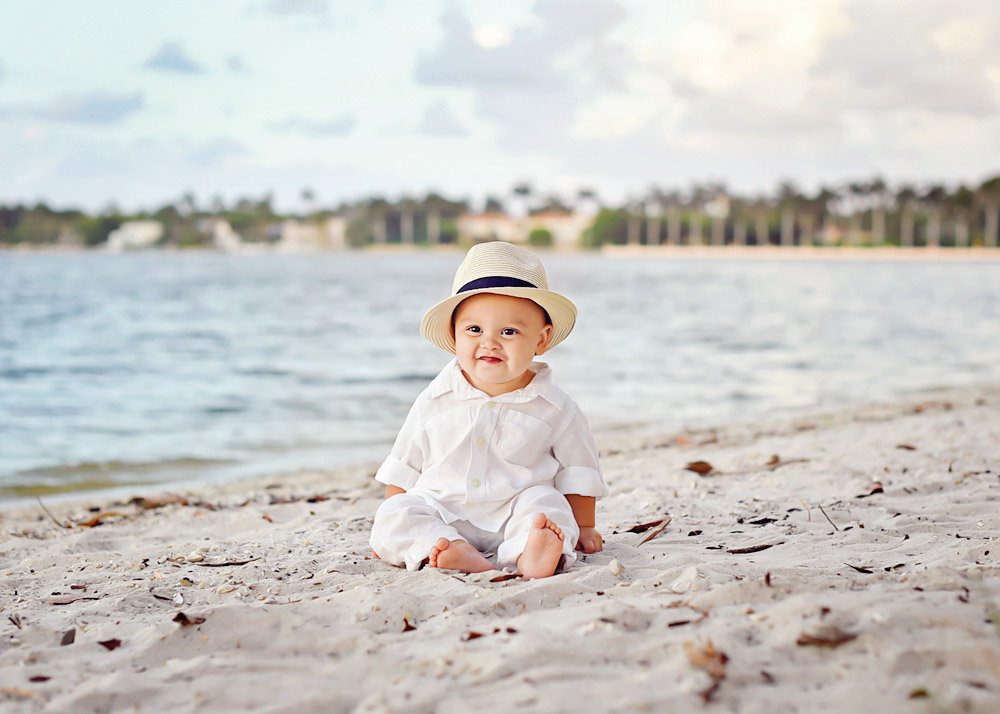 WEB-Noah little smirk w hat on beach.jpg