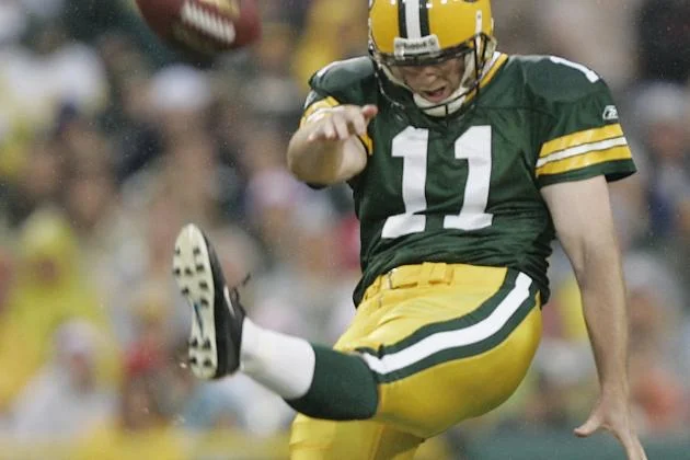 Punter B.J. Sander was selected by the Packers in the third round of the 2004 NFL Draft.