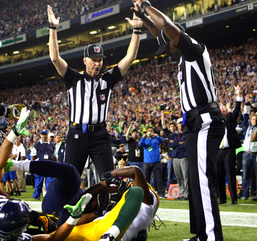 After a ten minute review, the replacement referees ruled Tate caught the ball for a game-winning touchdown.