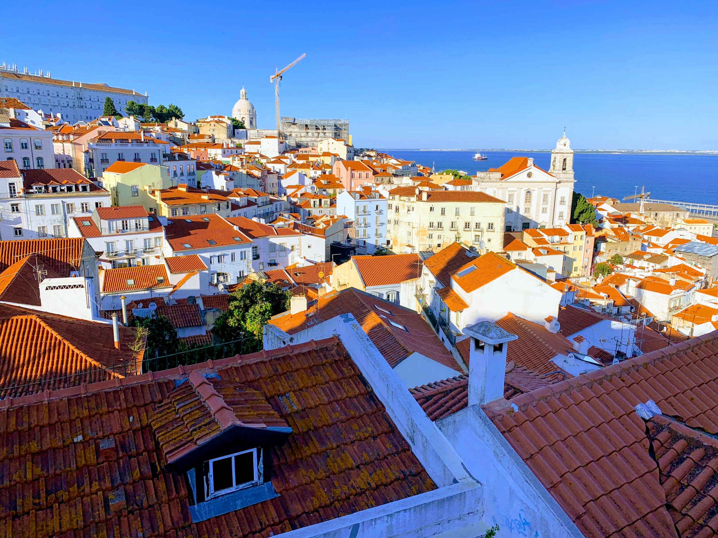 Lisbon - red-roofed homes by the sea