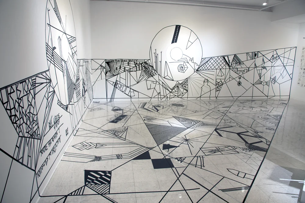  Installation image of Center Court: Exploring Sacred Geometry through Line  pedestal, tape on wall and floor  25'x17'x35'  2016 