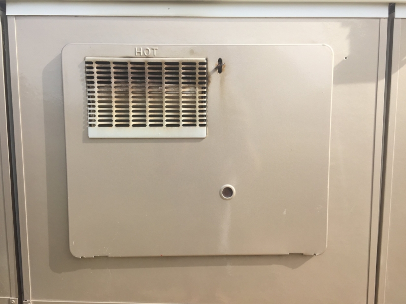 This is what your RV water heater access panel looks like! Notice the black on the vent.