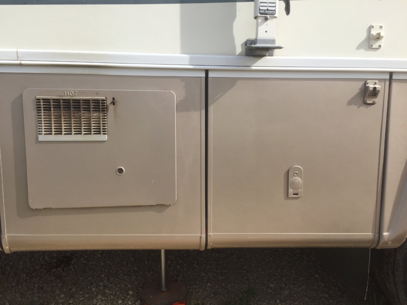 Access panel on the left. The storage door on the right is where we found the above valves we needed to turn on. 