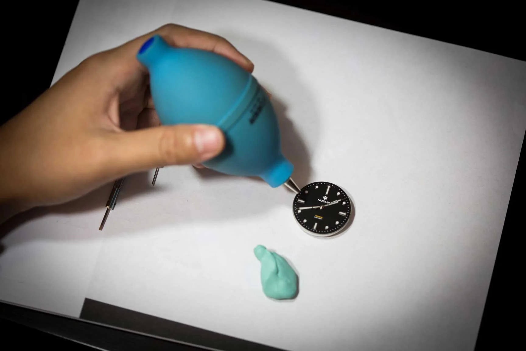 Cleaning dust off a dial