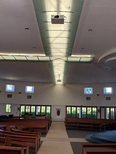 Holy cross catholic church - kippa ring - qld - 2 x panasonic dlp laser projectors projecting onto side walls of a round building - crestron hdmi switching