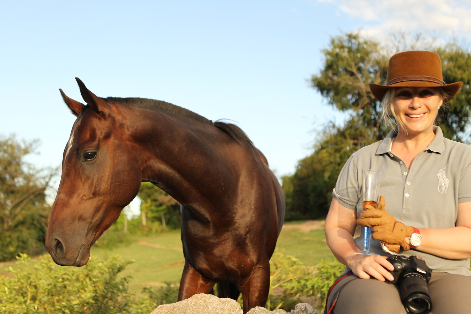 Holiday guest relaxing with a horse at Los Potreros