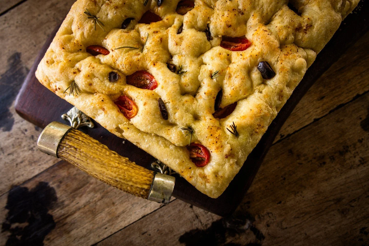 Homemade foccacia, with roasted tomatoes and black olives.... 
Photo @anyacampbellphotography