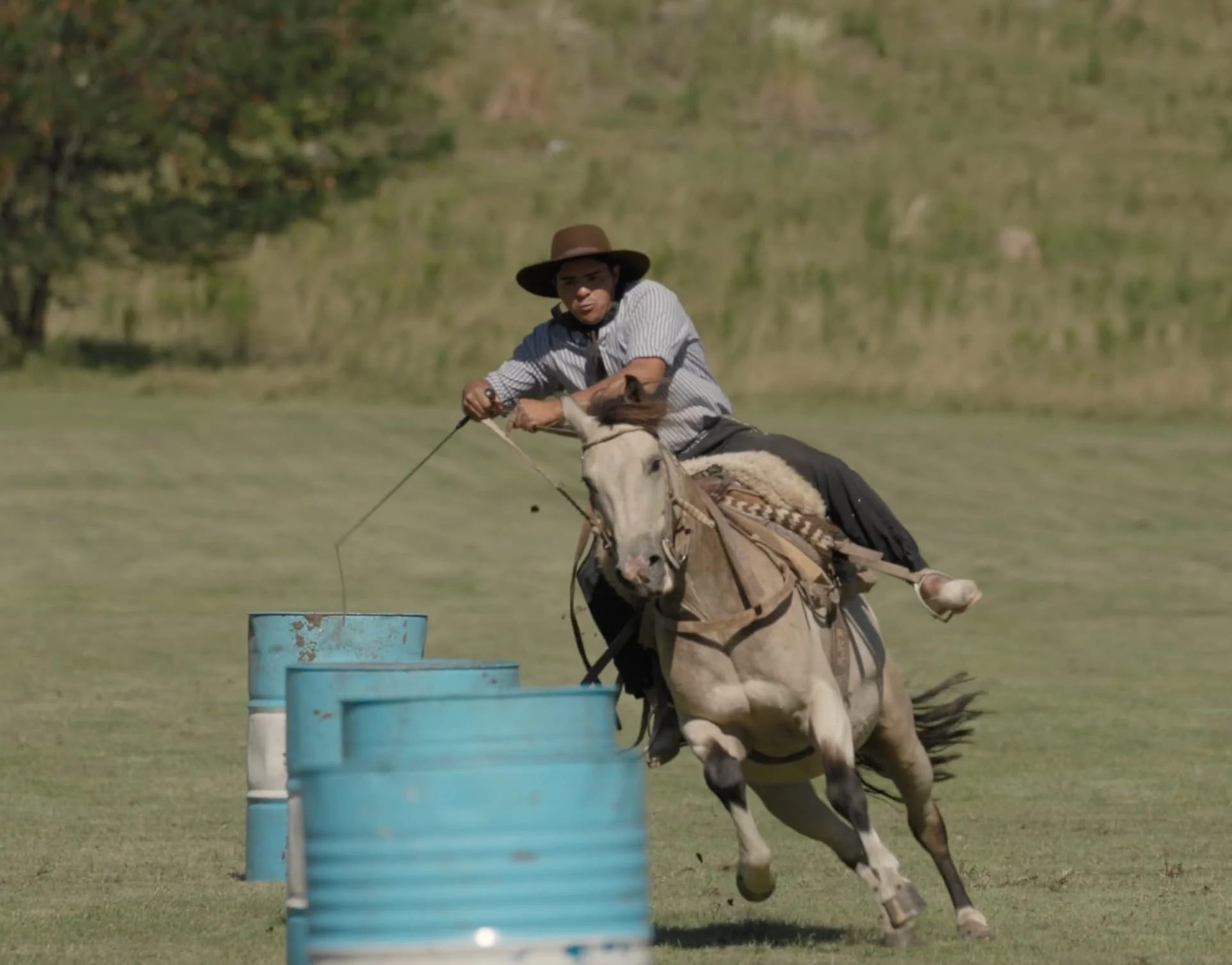 Gaucho showcasing horsemanship skills during traditional games at Estancia Los Potreros.