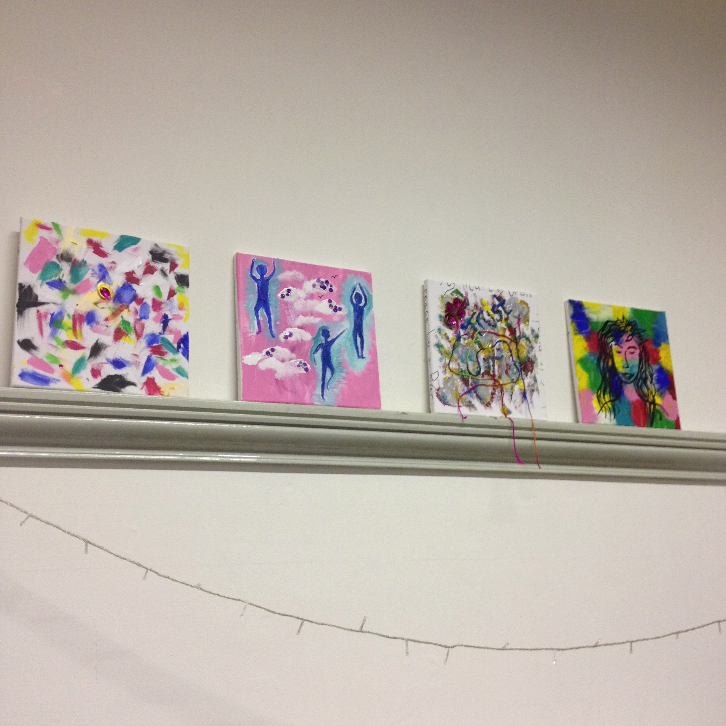 expressive canvases painted by young people during an arts workshop