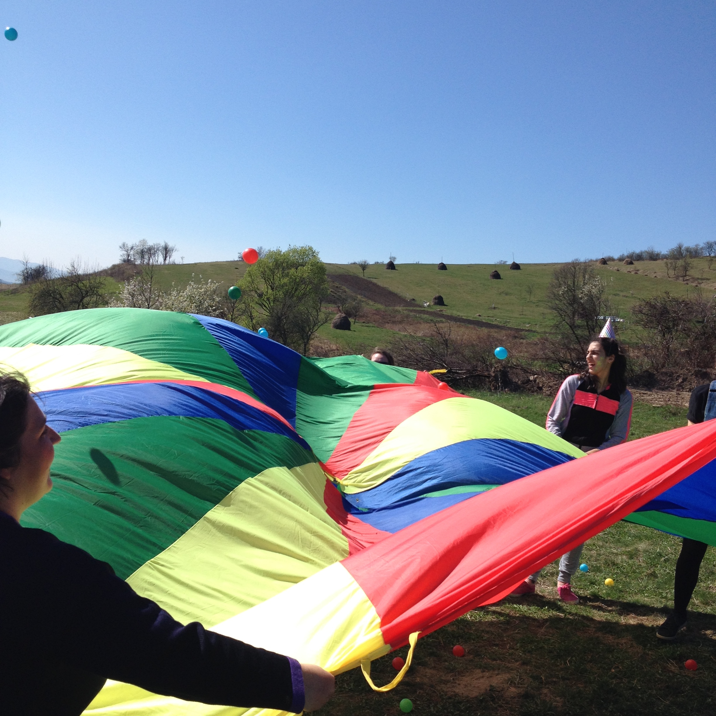 parachute games at community fun day at Casa Harilui, Romania