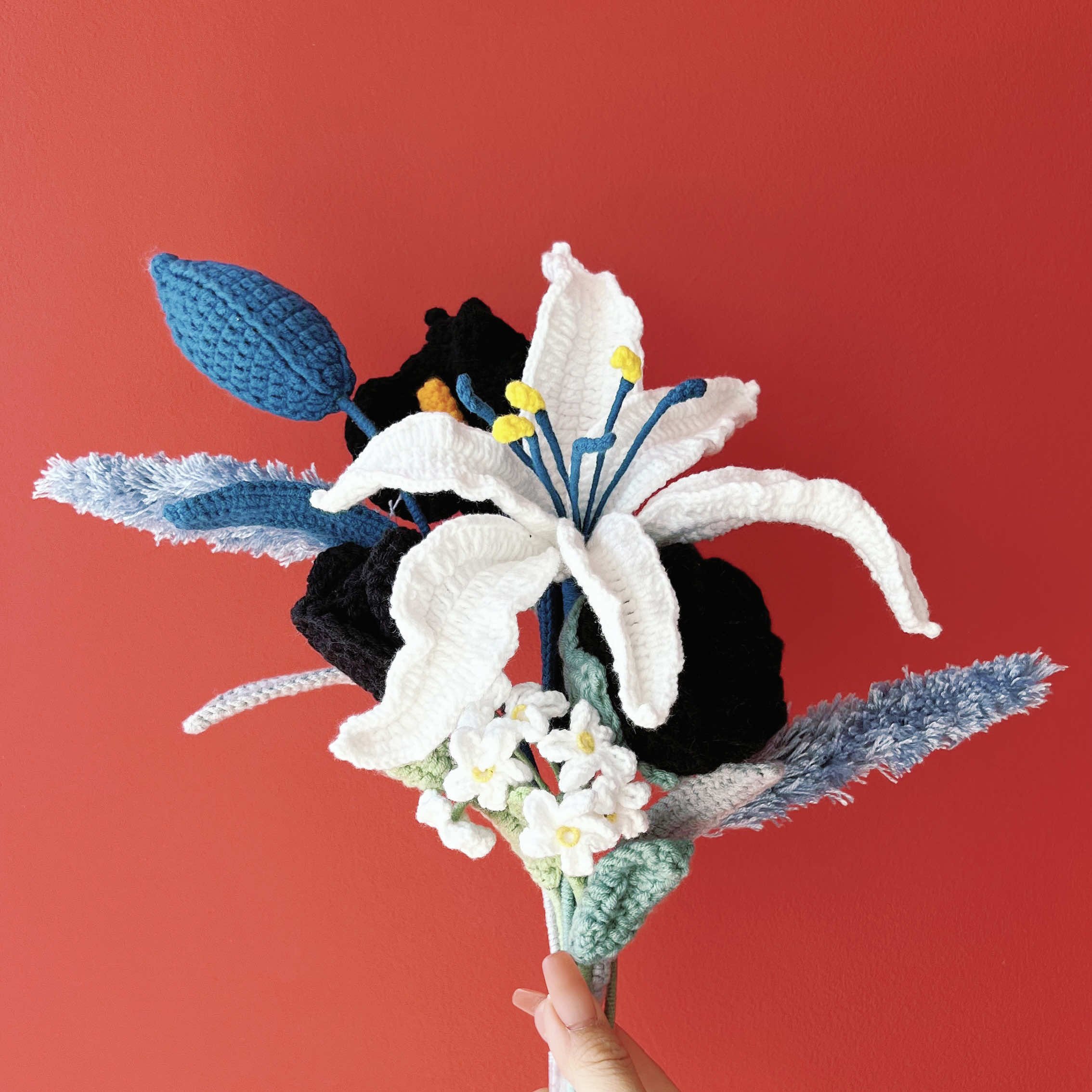 crochet bouquet of blue lily and black tulips.jpg