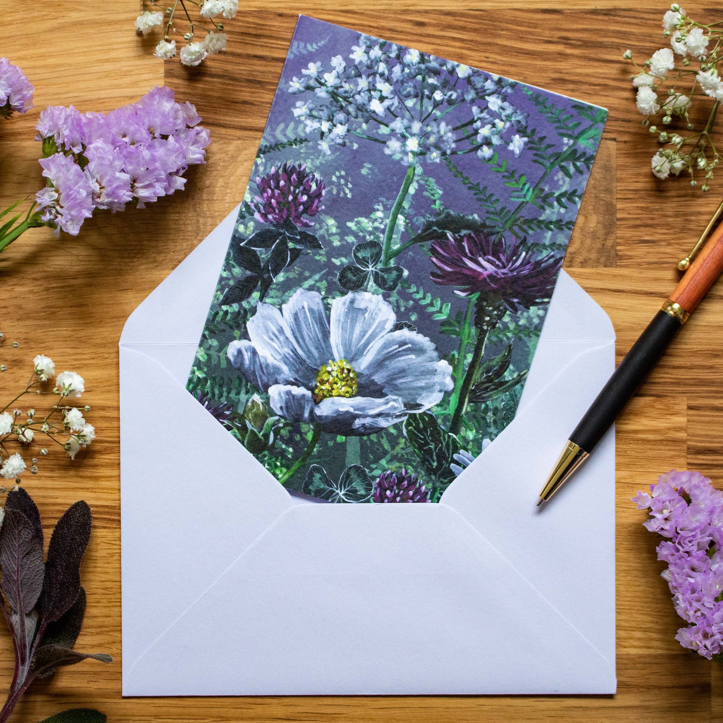 Floral Mystery Greeting Card-card with envelop on table top.jpg
