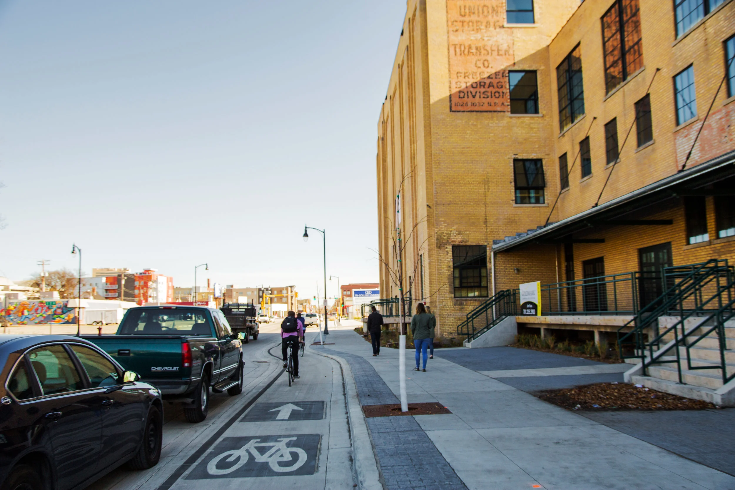 The design for the converted one-ways thoughtfully links the streets railroad history by reclaiming granite curbstones, and using a gray Milbank granite and iron palette for materials and striping. 