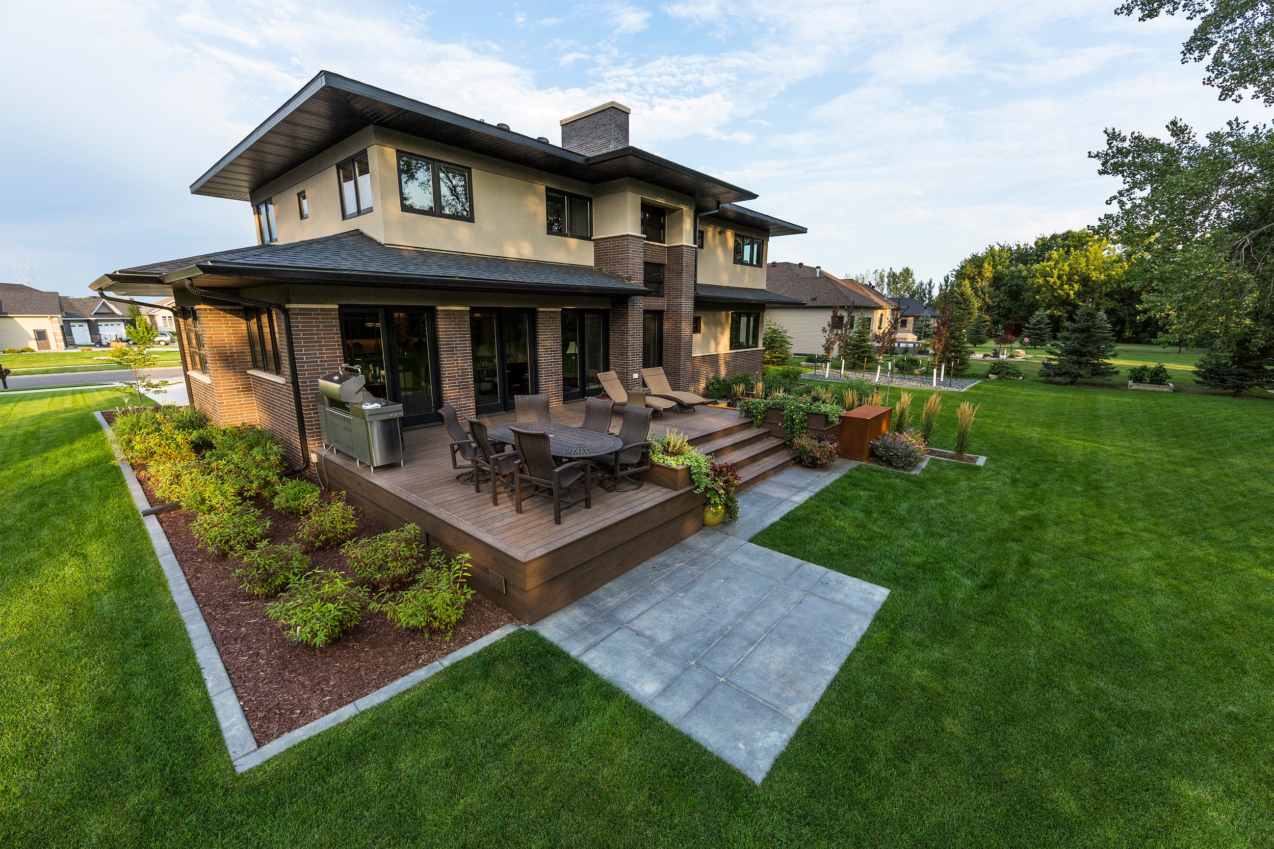 The design for this modern craftsman style home in Fargo was inspired by the strong lines in the architecture, which were then reflected onto the landscape. 