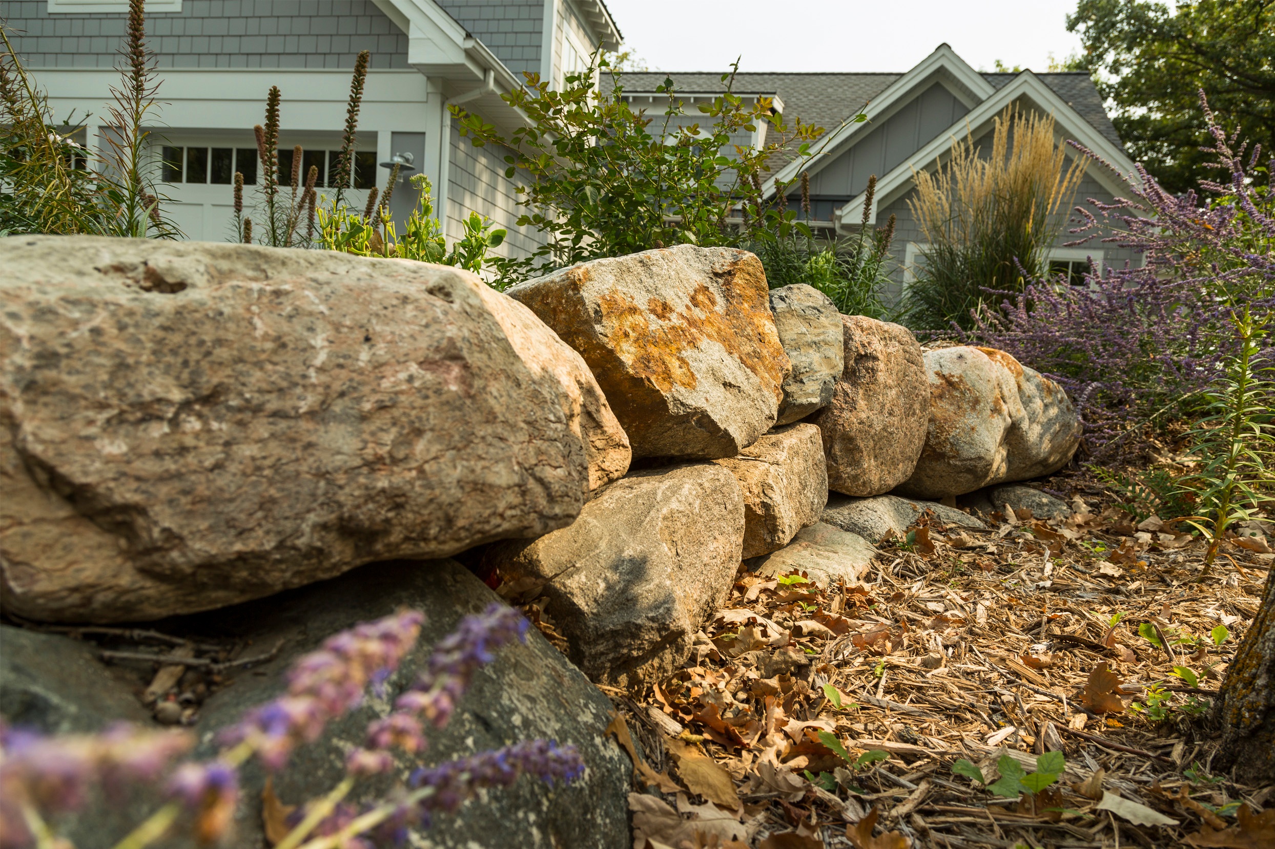 Natural stone outdroppings brings out the natural look of the home.