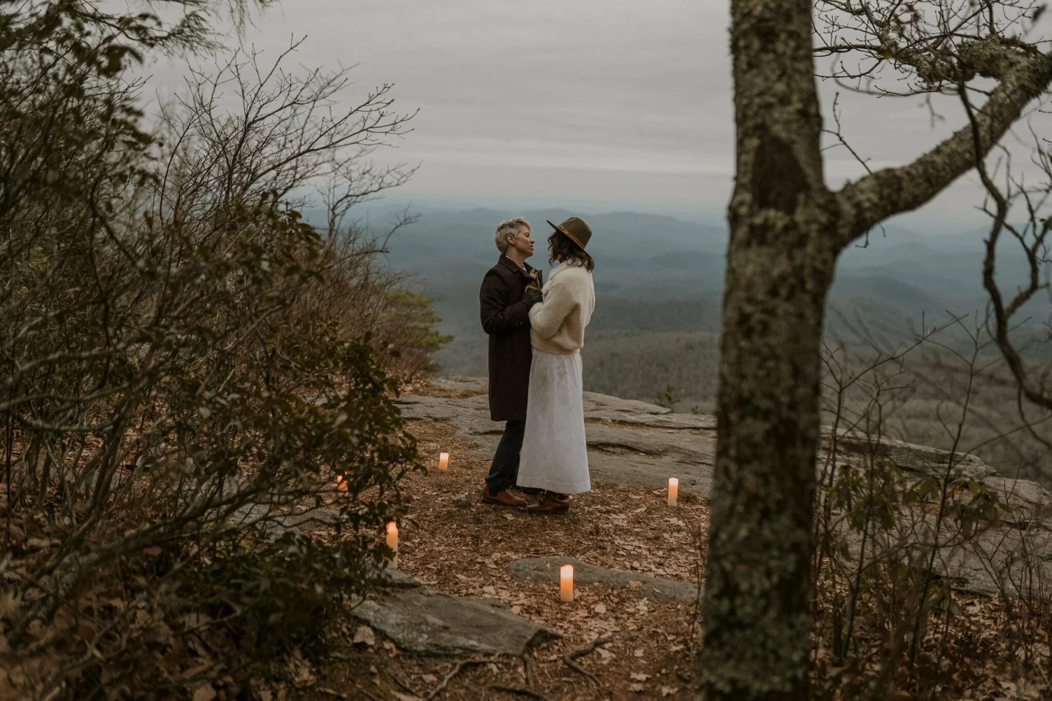 winter-elopement-dancing-on-mountaintop.jpg