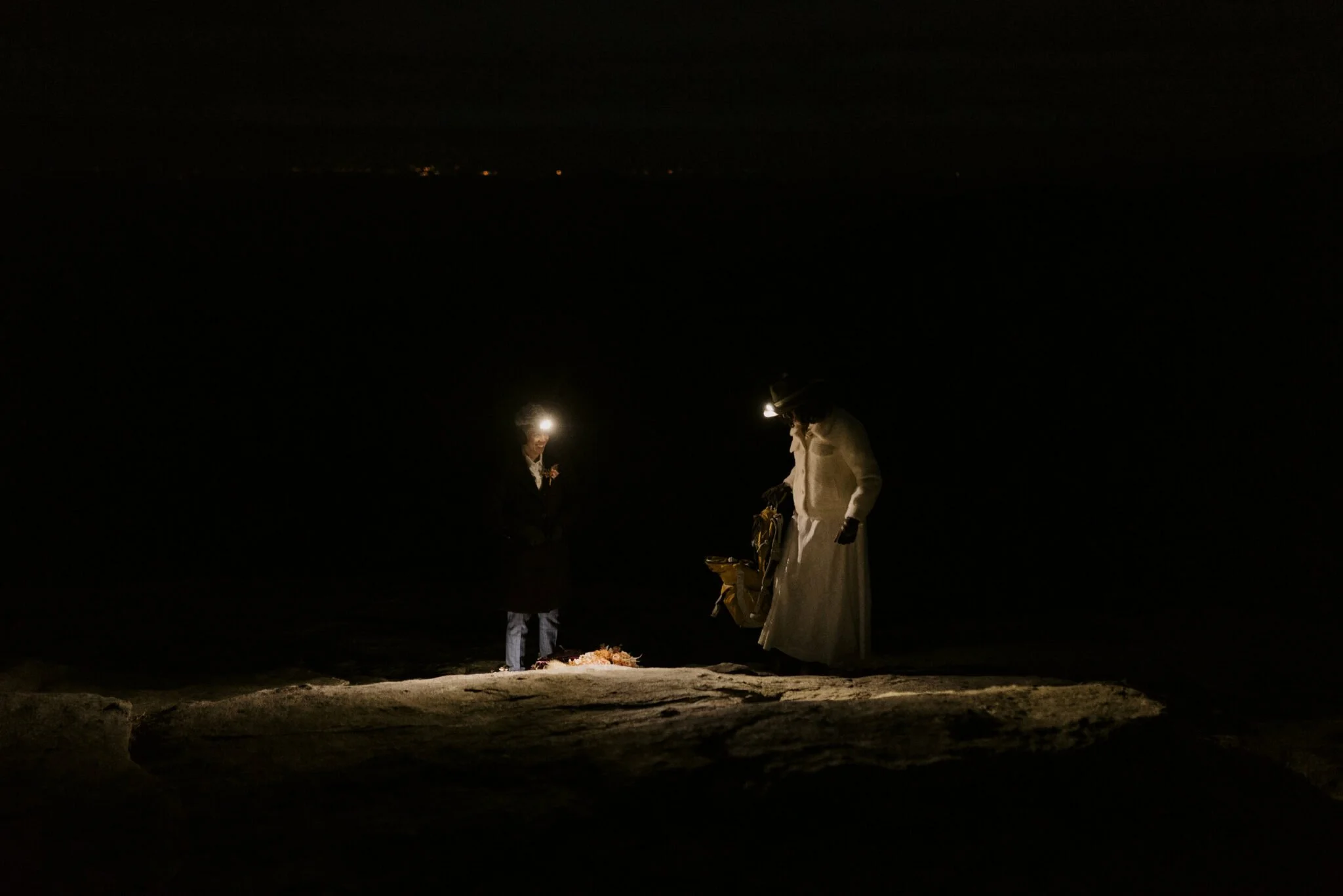 winter-elopement-standing-with-headlamps.jpg