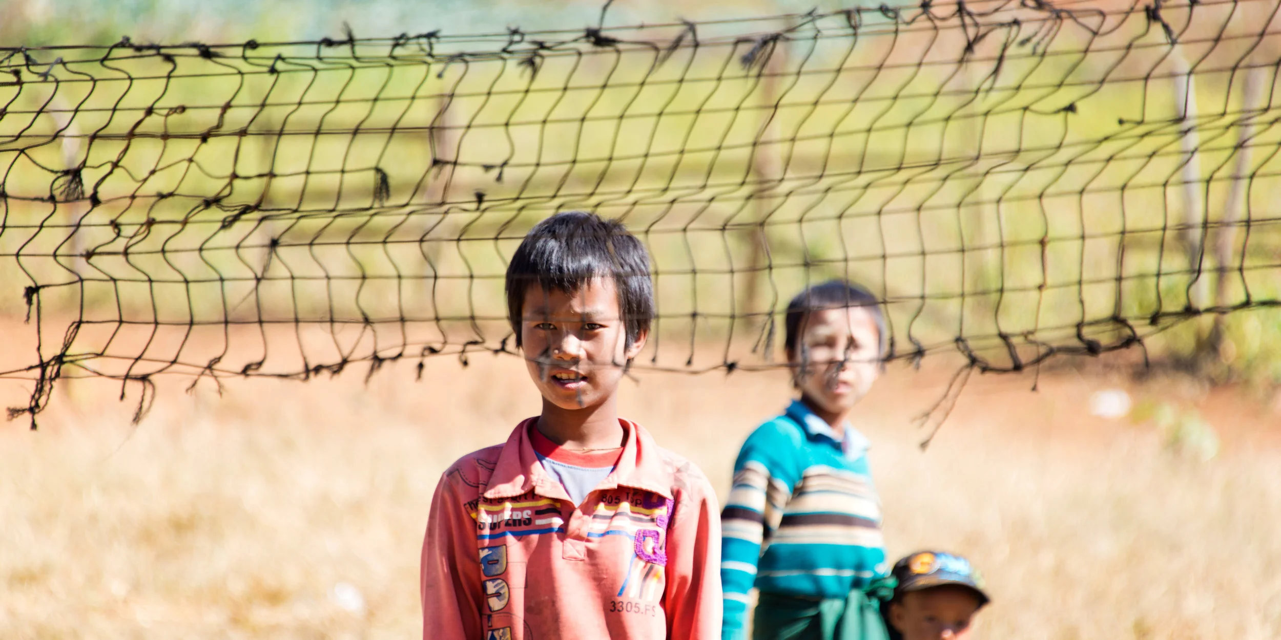 burmese_boy_at_volleyball_net_kp.jpg