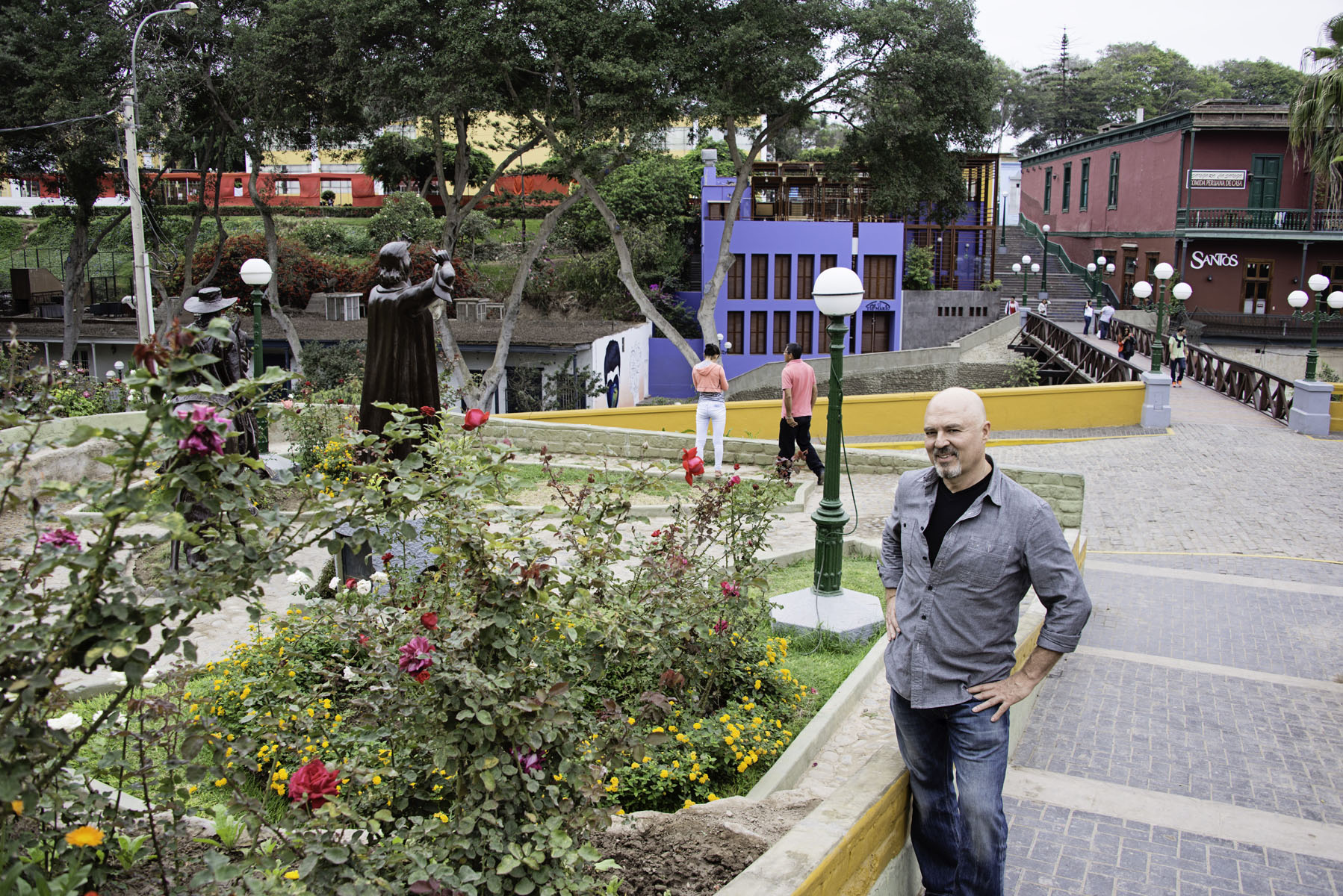 Fabio Posing Next to Flowers in Barranco Lima