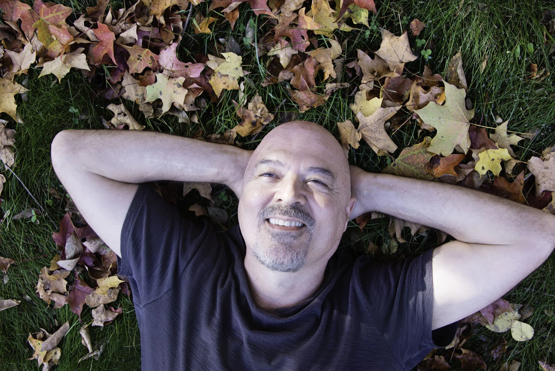 Man Laying in Leaves