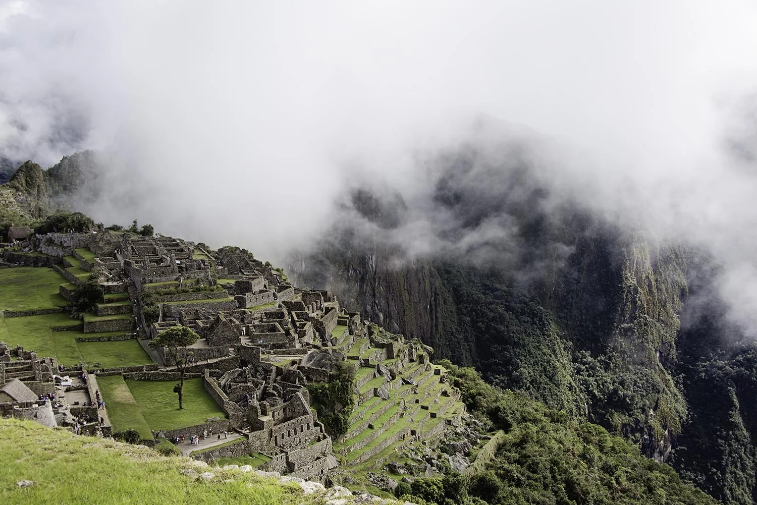 clouds surrounding machu picchu