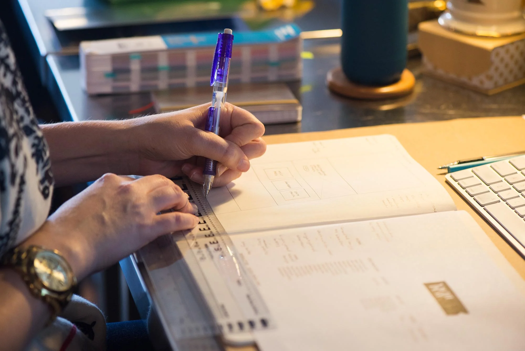 graphic designer sketching layout