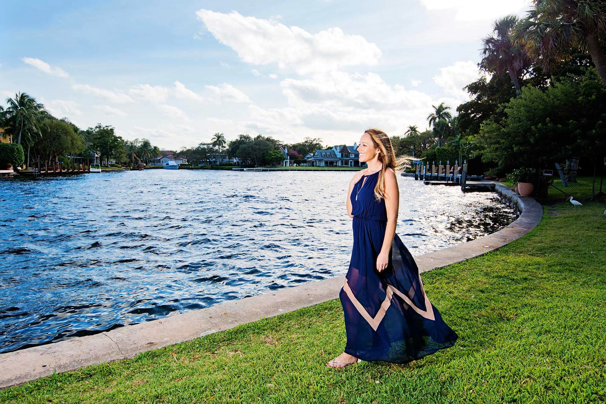 happy woman in park by water