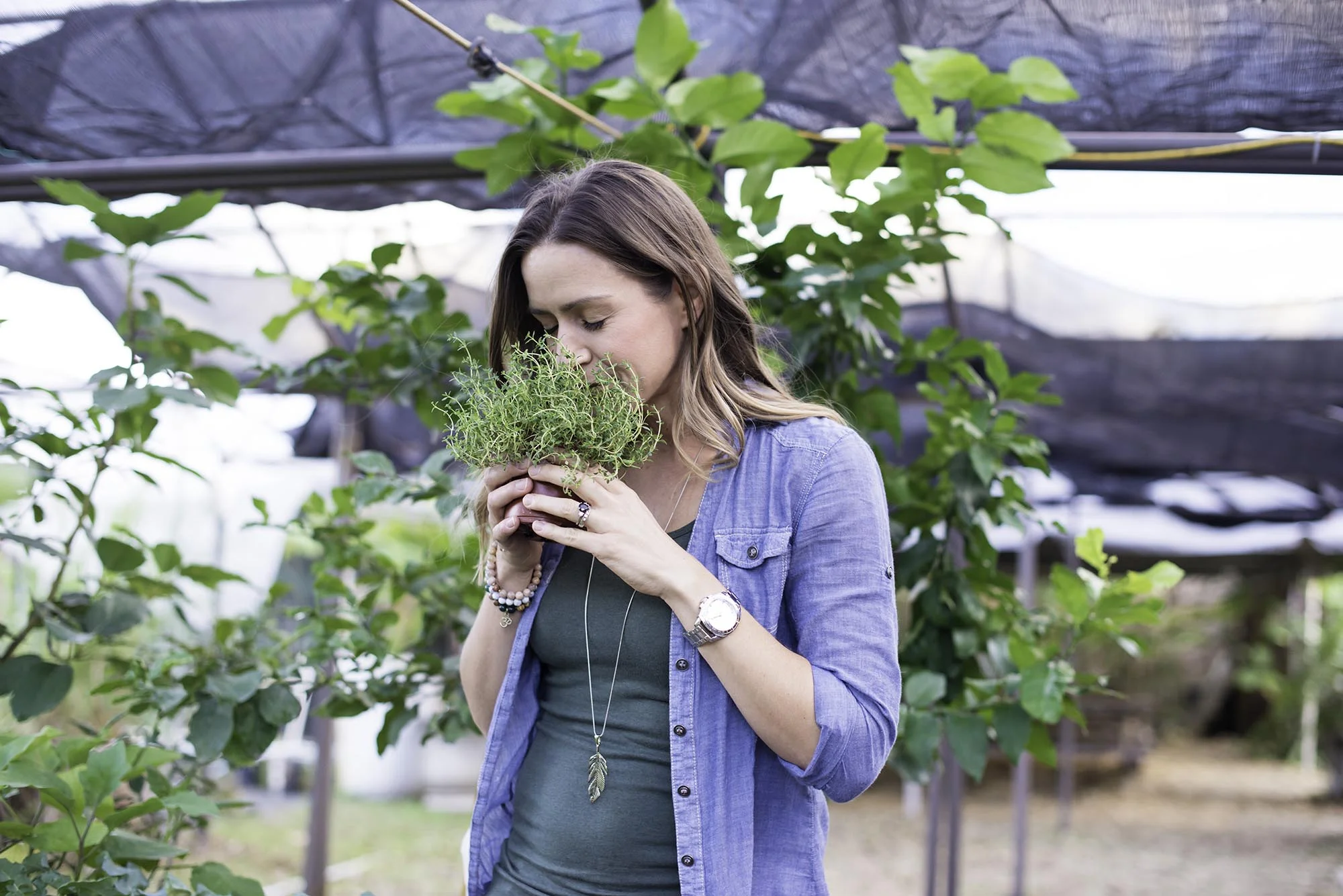 Woman Smelling Herbs
