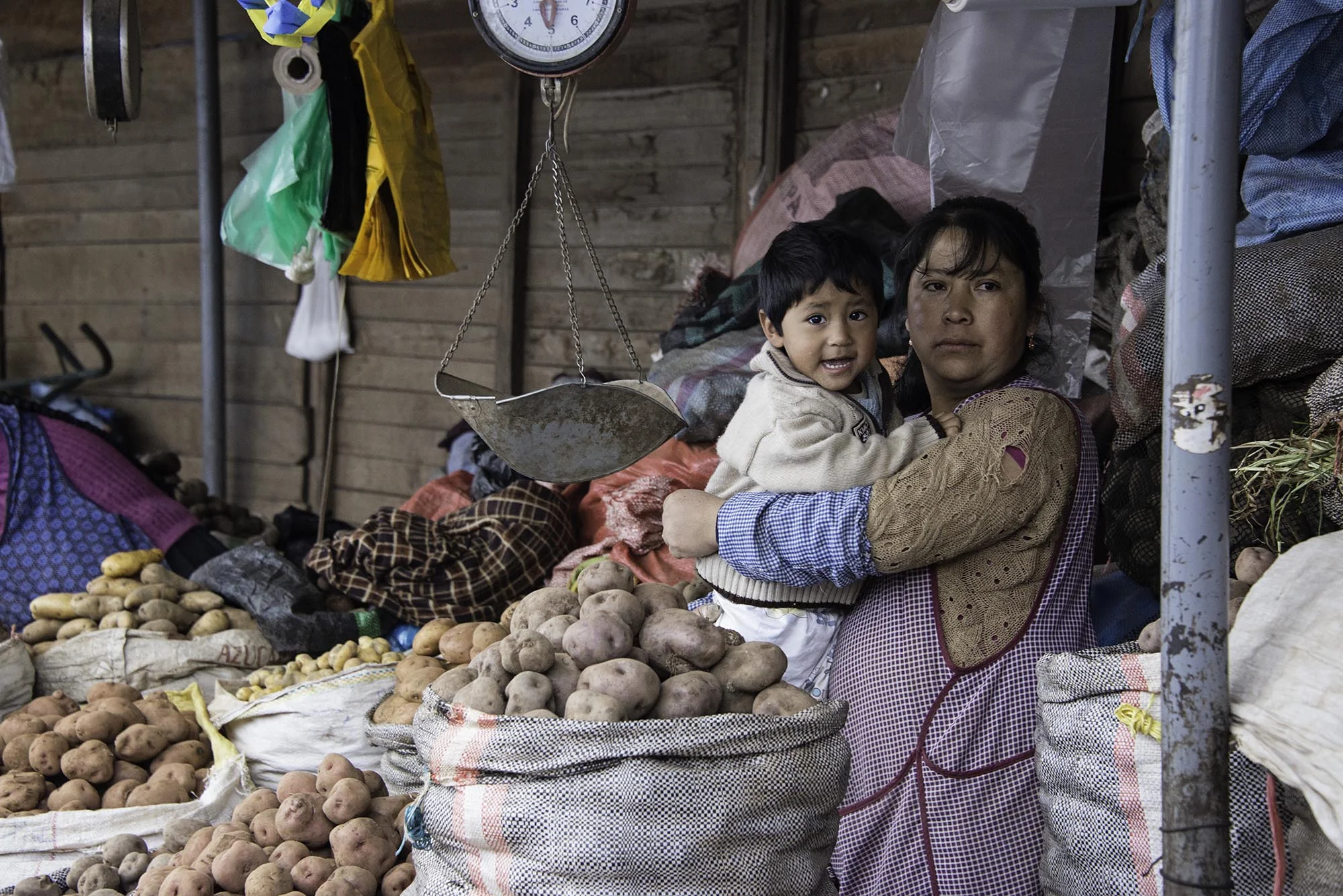 woman_and_son_selling_potatoes_peru.jpg