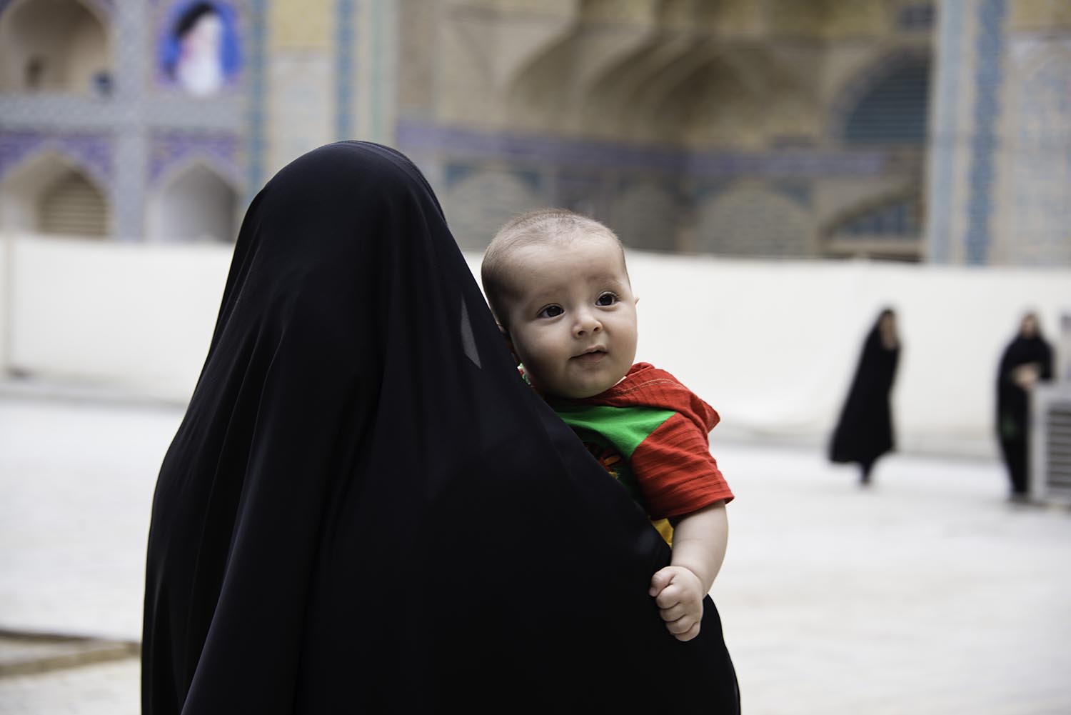 Muslim Woman Carrying a Baby