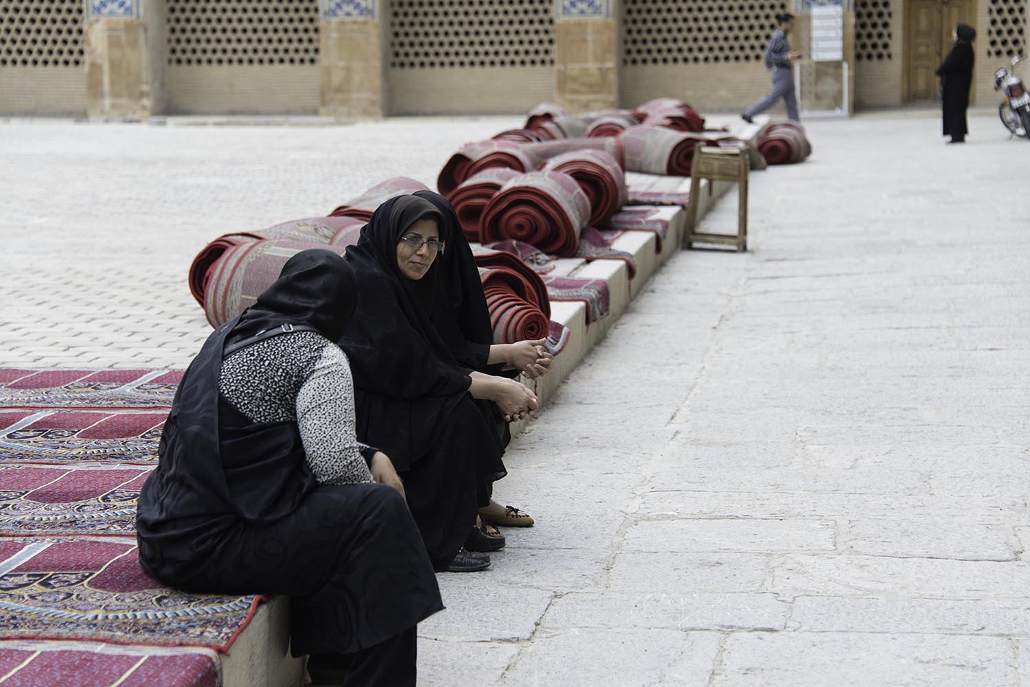 Muslim Women Sitting on Prayer Rugs