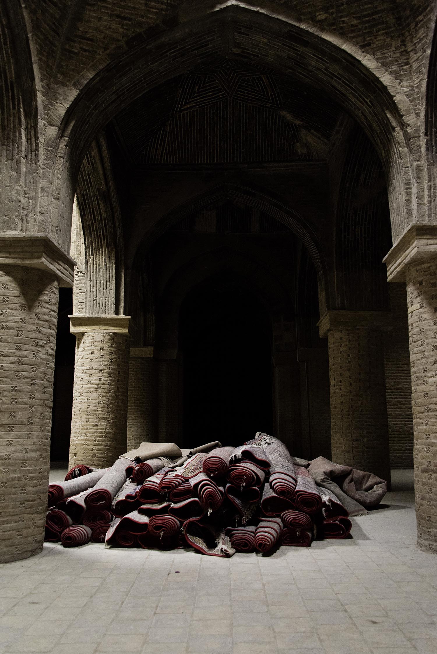 Pile of Rolled Prayer Rugs