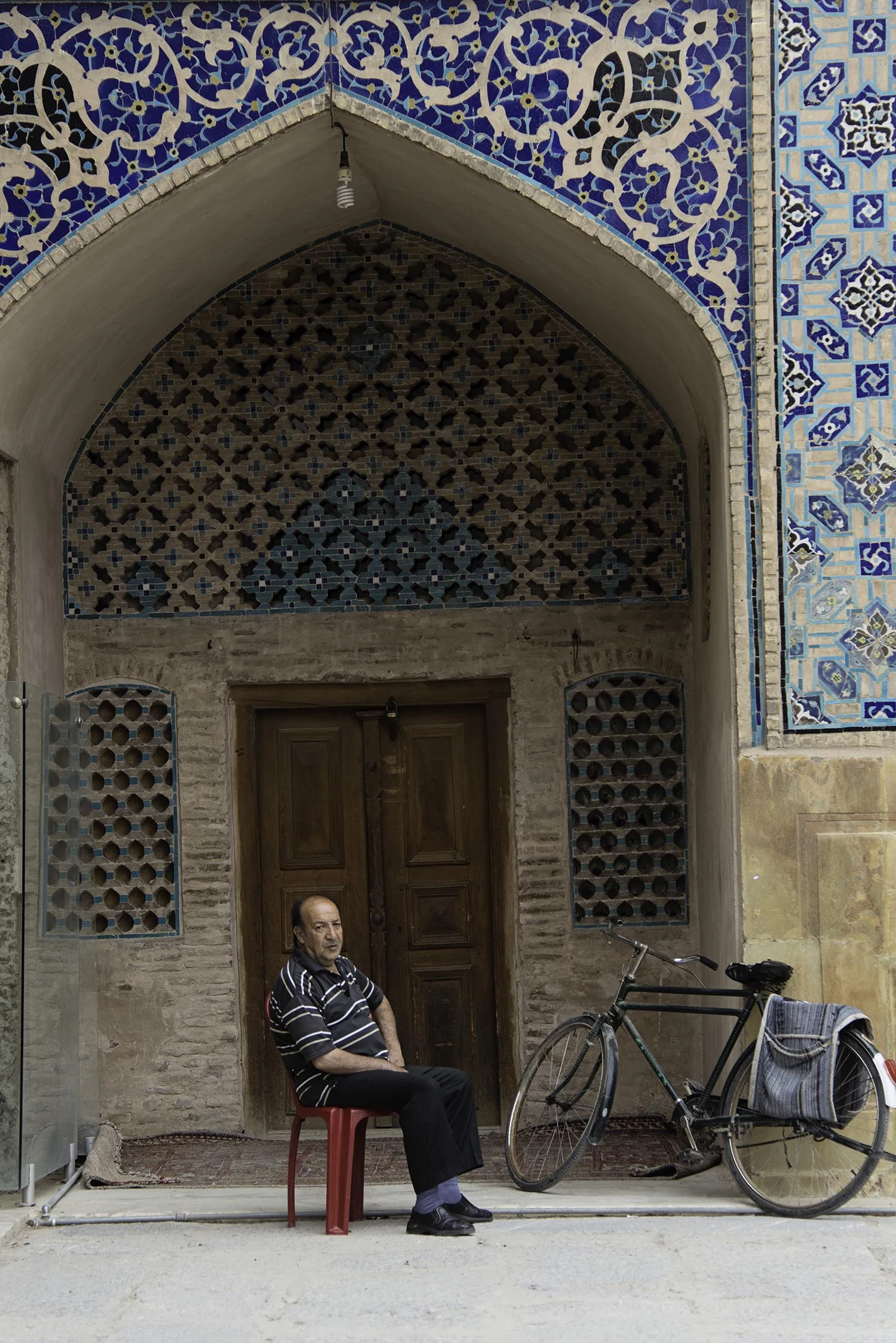 Iranian Man Sitting Under Arch