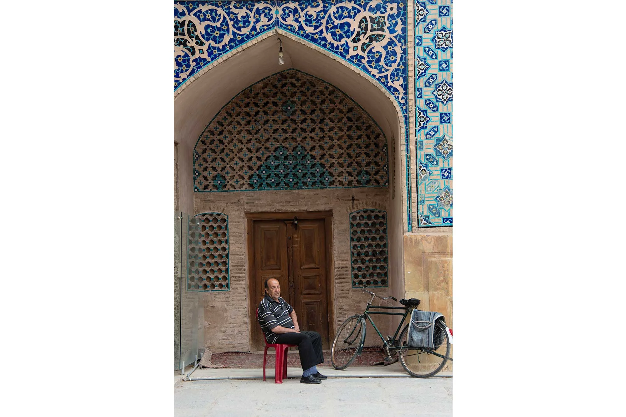 Iranian Man Sitting Under Arch