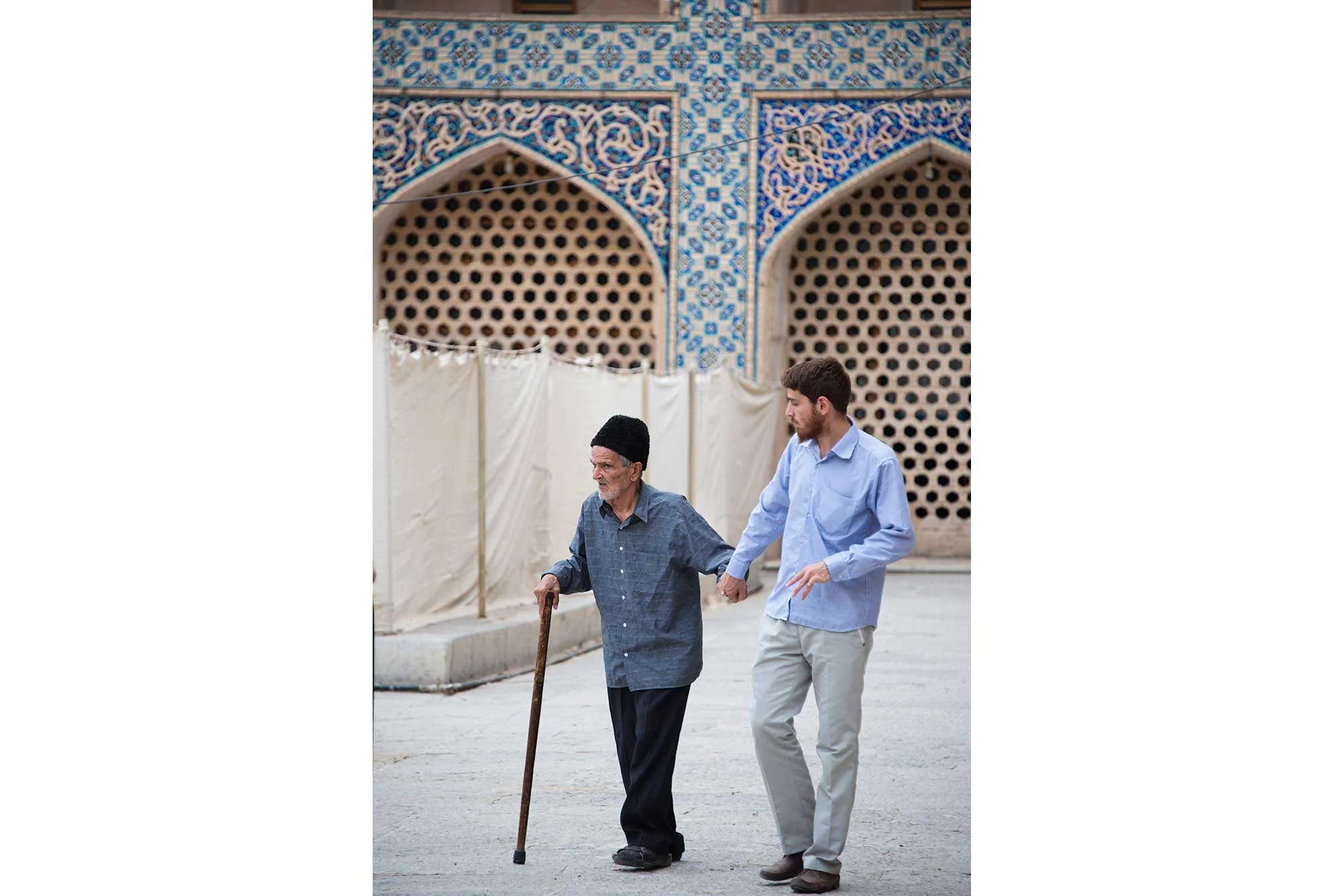 Young Man Walking with Old Man