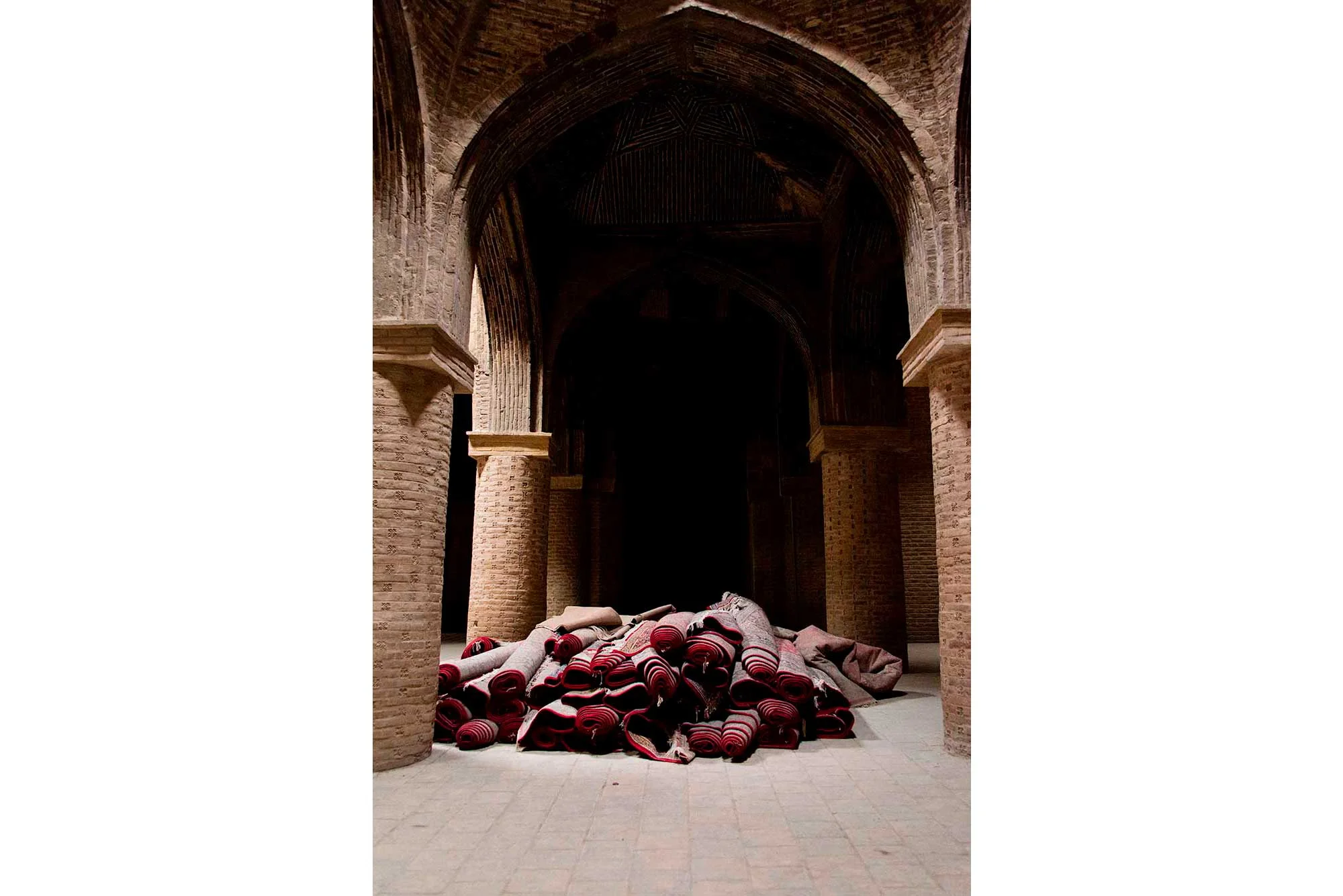 Pile of Rolled Prayer Rugs