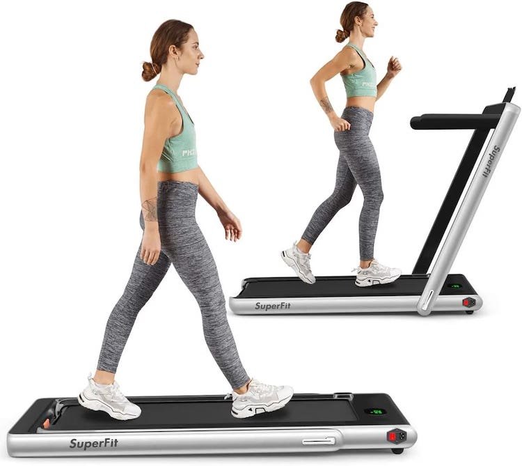 woman walking on slim foldable under the desk treadmill